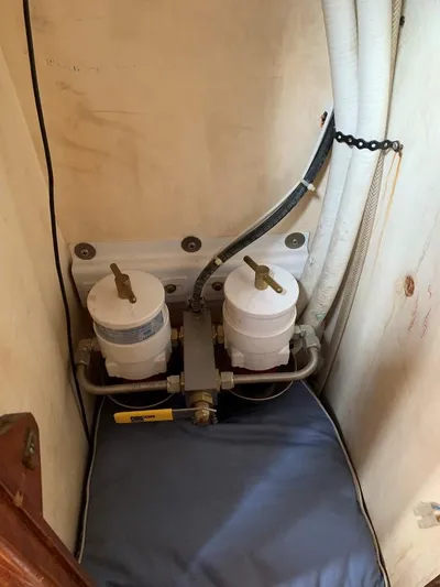 Here Be Dragons Yacht Photos Pics 1987 Oyster 46.5 yacht engine compartment with dual fuel filters and hoses.