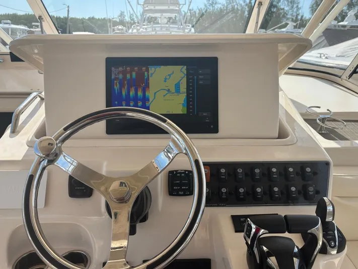  Yacht Photos Pics Grady-White Express 330 helm with navigation system, 2023 model.