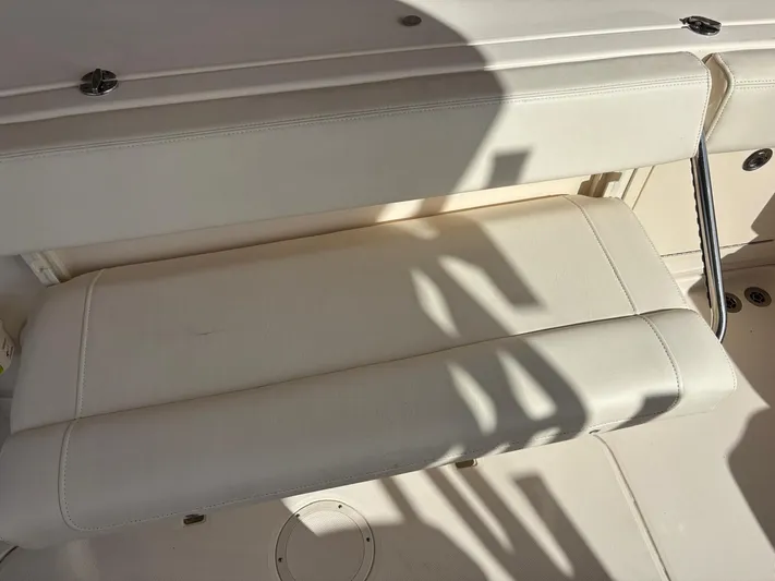  Yacht Photos Pics Grady-White Express 330 2023, white bench seat in sunlight.