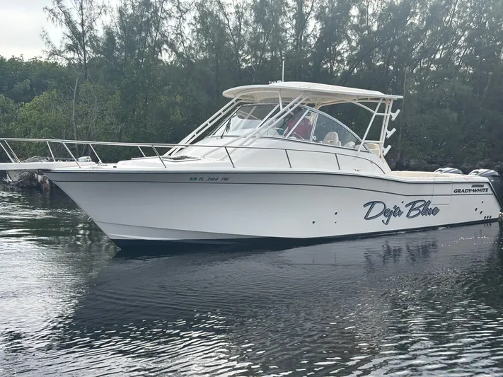  Yacht Photos Pics 2023 Grady-White Express 330 boat on calm water.