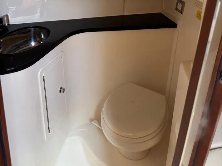  Yacht Photos Pics Interior of Grady-White Express 330 yacht, bathroom with toilet and sink.