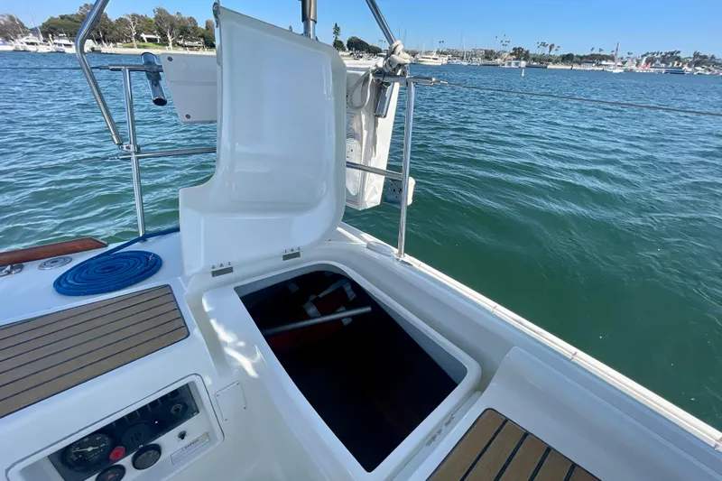 Caravan Yacht Photos Pics Open hatch on 2003 Beneteau First 47.7 sailboat, docked in a marina.