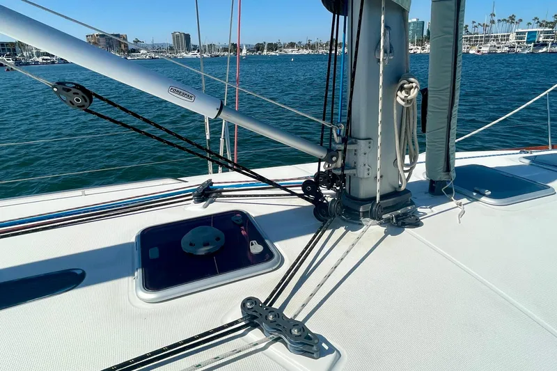 Caravan Yacht Photos Pics Deck view of 2003 Beneteau First 47.7 sailboat, showcasing rigging and hatch.