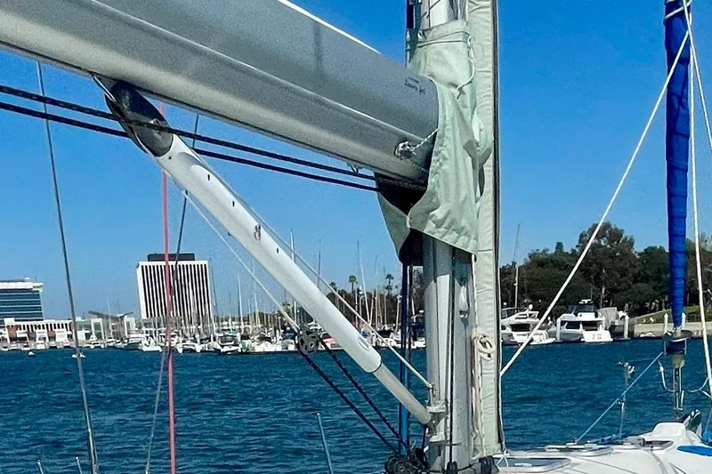 Caravan Yacht Photos Pics Sailboat mast and rigging of a 2003 Beneteau First 47.7 in a marina setting.