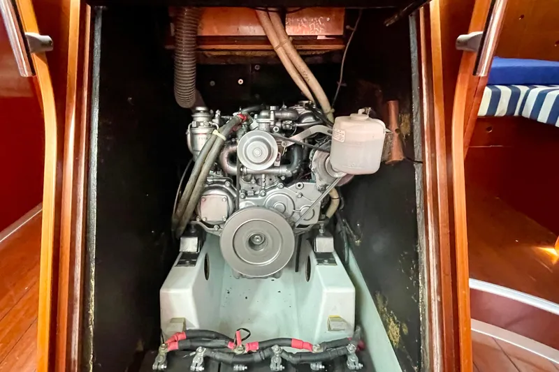 Caravan Yacht Photos Pics Engine compartment of 2003 Beneteau First 47.7 sailboat, showcasing mechanical components.