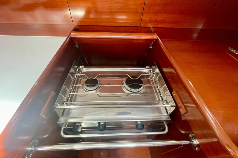 Caravan Yacht Photos Pics Compact stove in the galley of a 2003 Beneteau First 47.7 sailboat.