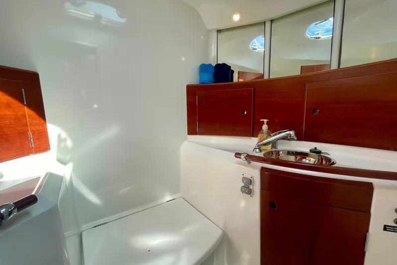 Caravan Yacht Photos Pics Luxurious bathroom interior of 2003 Beneteau First 47.7 yacht with wooden cabinetry.