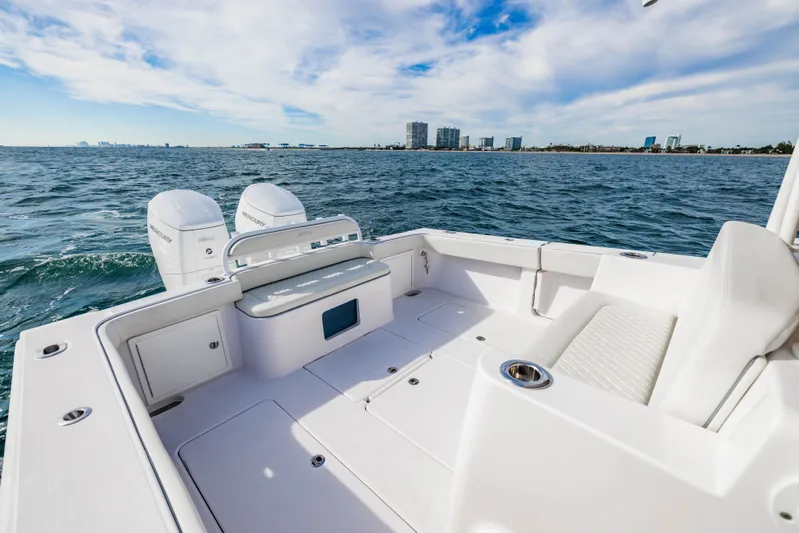  Yacht Photos Pics Jupiter 40 boat 2023 on open sea with city view.