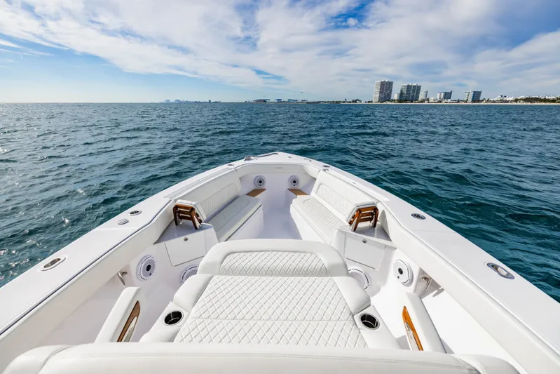  Yacht Photos Pics Jupiter 40 boat 2023 on open sea with city view.