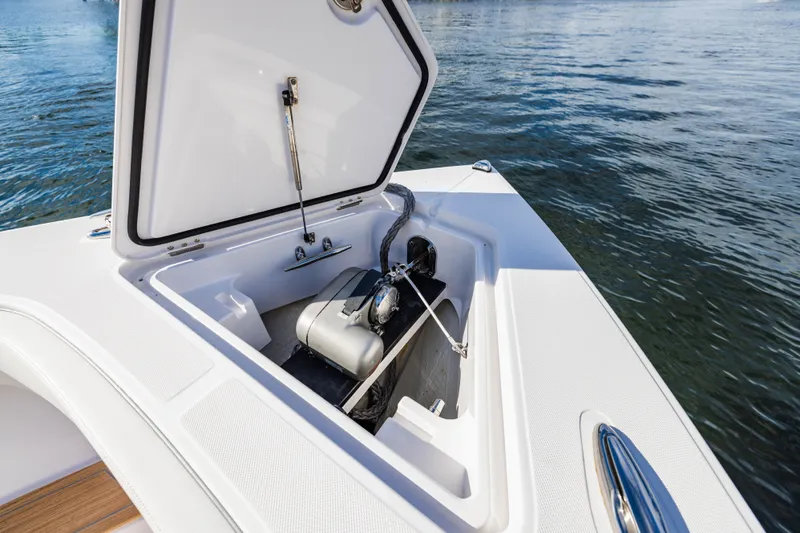  Yacht Photos Pics Jupiter 40 boat 2023 with open storage compartment by the water.