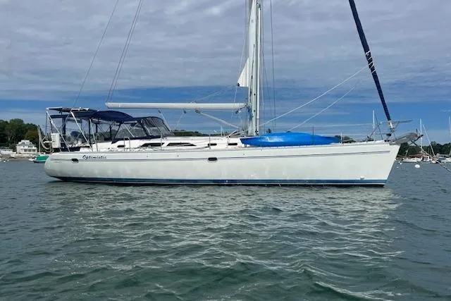 Optimistic Yacht Photos Pics 2003 Catalina 470 Sloop with Wing Keel sailing on calm waters.