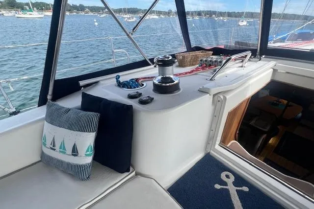 Optimistic Yacht Photos Pics Cockpit of 2003 Catalina 470 Sloop with Wing Keel, featuring nautical decor and winch.