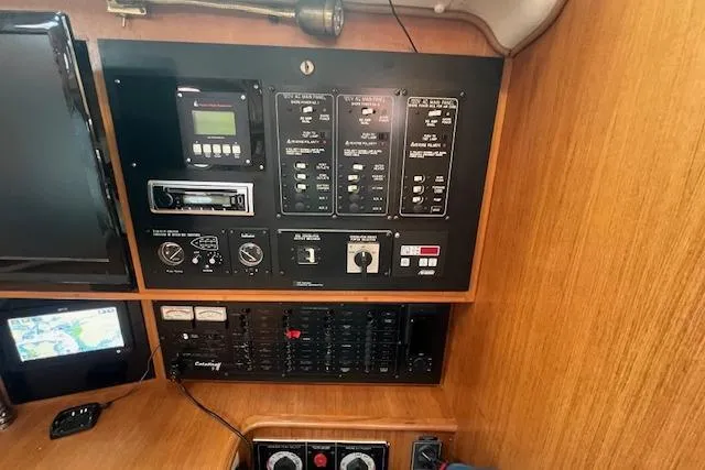 Optimistic Yacht Photos Pics Control panel of a 2003 Catalina 470 Sloop with Wing Keel, featuring navigation and electrical systems.