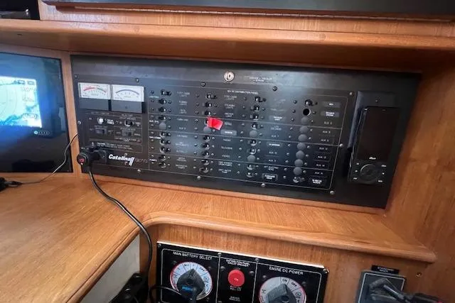 Optimistic Yacht Photos Pics Control panel of a 2003 Catalina 470 Sloop with Wing Keel, featuring navigation and power systems.