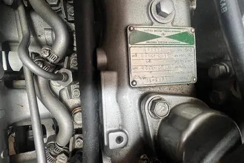 Optimistic Yacht Photos Pics Close-up of a 2003 Catalina 470 Sloop engine components and identification plate.