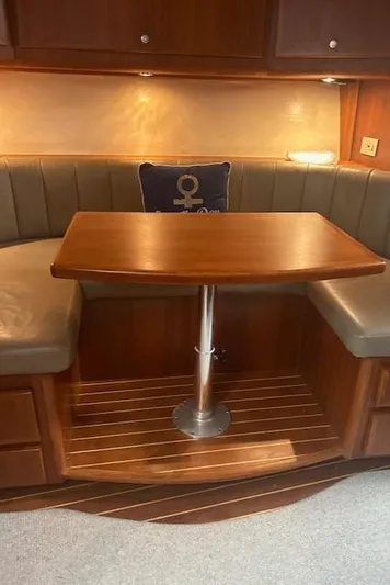  Yacht Photos Pics Luxurious wooden dining area inside a 2006 Topaz 40 Express yacht.
