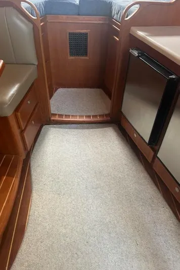  Yacht Photos Pics Interior of 2006 Topaz 40 Express yacht with wood cabinetry and compact kitchen.