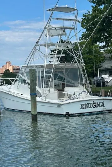  Yacht Photos Pics 2006 Topaz 40 Express boat named Enigma docked in a marina.