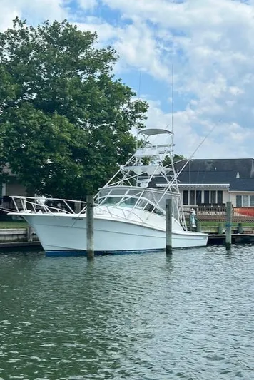  Yacht Photos Pics 2006 Topaz 40 Express boat docked at a marina.