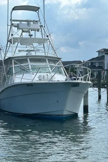  Yacht Photos Pics 2006 Topaz 40 Express boat docked in a marina.
