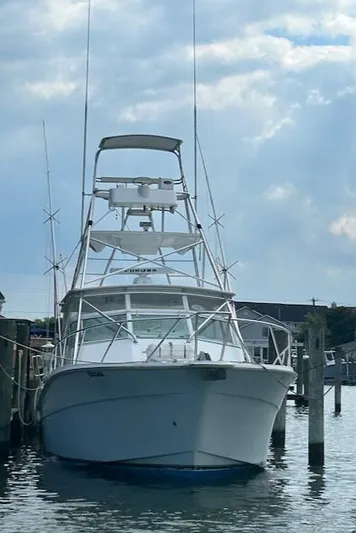  Yacht Photos Pics 2006 Topaz 40 Express boat docked at a marina.