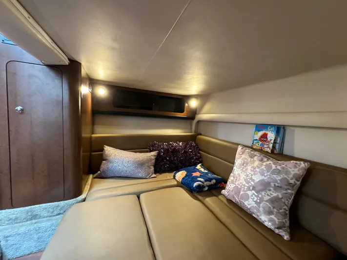  Yacht Photos Pics 2018 Crownline 350 SY cabin interior with cozy seating and decorative pillows.
