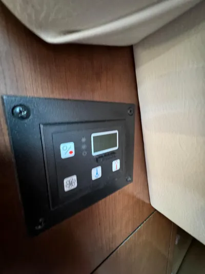  Yacht Photos Pics Control panel inside 2018 Crownline 350 SY boat, featuring digital display and buttons.