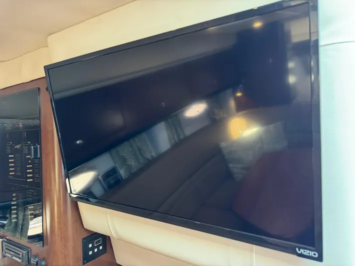  Yacht Photos Pics Flat-screen TV inside 2018 Crownline 350 SY yacht cabin, featuring a Vizio display.