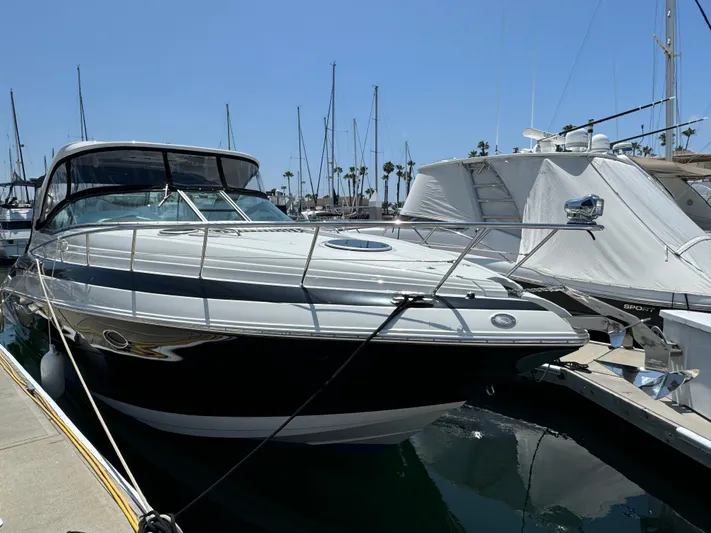  Yacht Photos Pics 2018 Crownline 350 SY yacht docked at marina under clear blue sky.