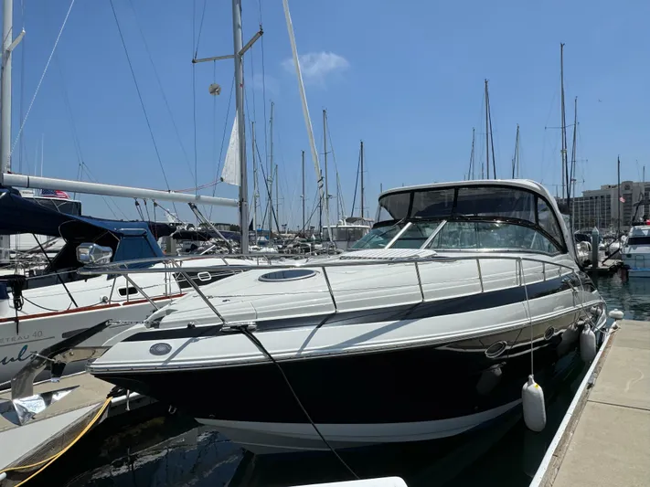  Yacht Photos Pics 2018 Crownline 350 SY yacht docked at marina under clear blue sky.