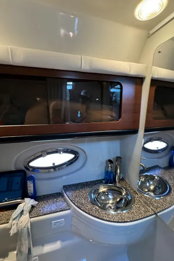  Yacht Photos Pics Interior of 2018 Crownline 350 SY yacht bathroom with modern sink and porthole window.