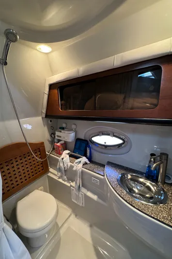  Yacht Photos Pics 2018 Crownline 350 SY yacht bathroom with modern fixtures and porthole window.