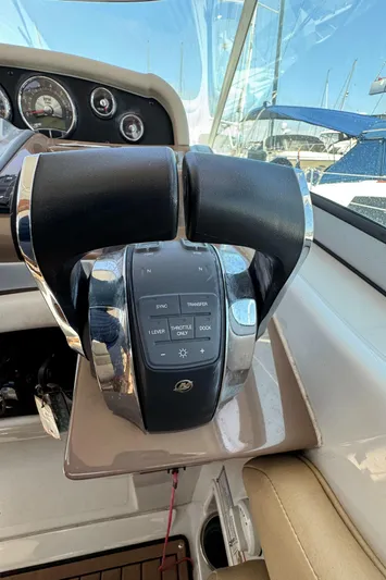  Yacht Photos Pics Throttle controls of a 2018 Crownline 350 SY boat, featuring a sleek design.