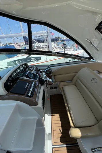  Yacht Photos Pics 2018 Crownline 350 SY yacht interior with helm and seating area.