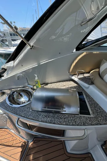  Yacht Photos Pics 2018 Crownline 350 SY yacht with sleek outdoor kitchenette and sink.
