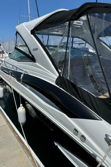  Yacht Photos Pics 2018 Crownline 350 SY yacht docked at marina, featuring sleek design and modern canopy.
