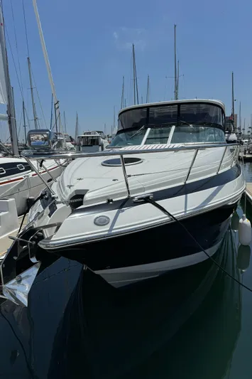  Yacht Photos Pics 2018 Crownline 350 SY yacht docked in a marina under a clear blue sky.