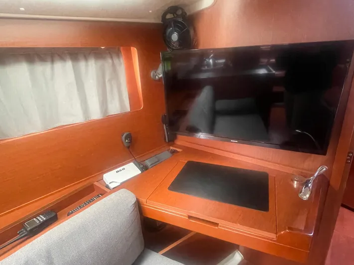 Danmark Yacht Photos Pics Interior of 2019 Beneteau Oceanis 41.1 yacht with TV and navigation equipment.