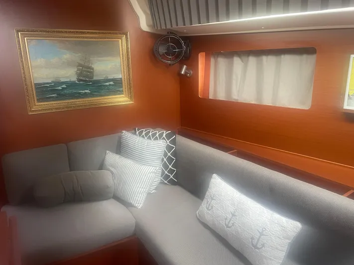 Danmark Yacht Photos Pics Interior of 2019 Beneteau Oceanis 41.1 yacht with cozy seating and nautical decor.