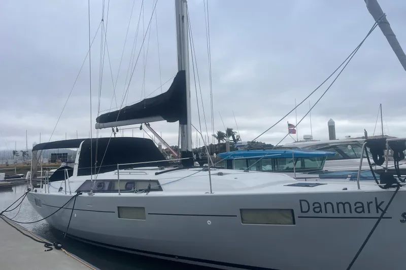 Danmark Yacht Photos Pics 2019 Beneteau Oceanis 41.1 sailboat docked at marina, overcast sky.