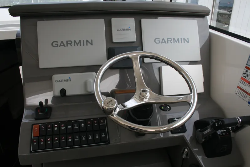 Skye Boat Yacht Photos Pics Helm of 2020 Pursuit OS 355 Offshore with Garmin navigation systems and controls.