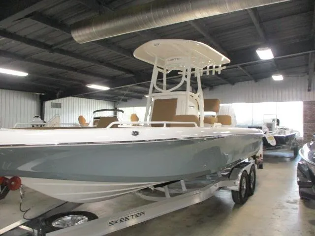 2025 Skeeter SX2550 boat on trailer in indoor showroom.