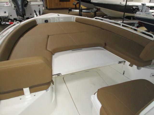 2025 Skeeter SX2550 boat interior with brown cushioned seating and white deck.