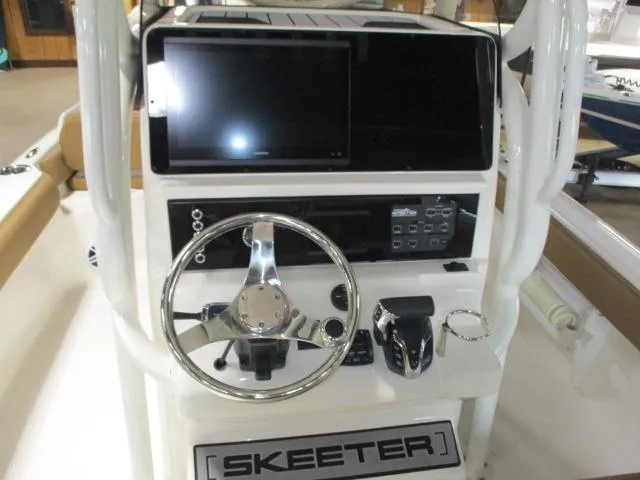 2025 Skeeter SX2550 boat console with steering wheel and electronic controls.