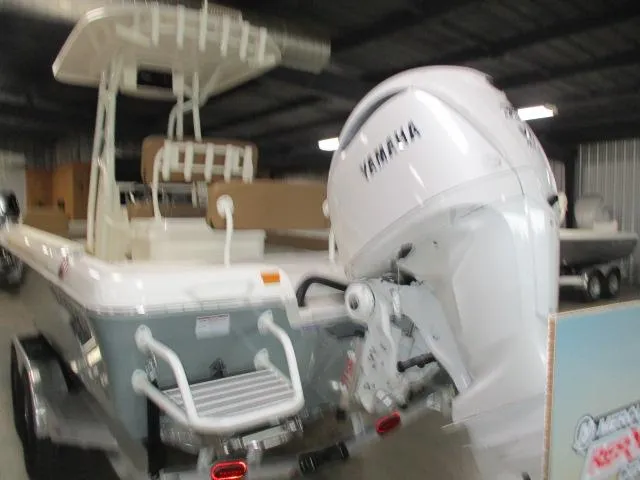 2025 Skeeter SX2550 boat with Yamaha outboard motor in a storage facility.
