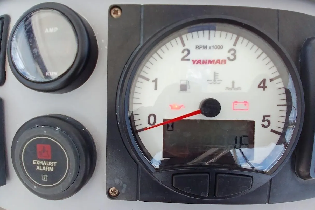 Control panel of a 2020 Leopard 40 with Yanmar RPM gauge and exhaust alarm.