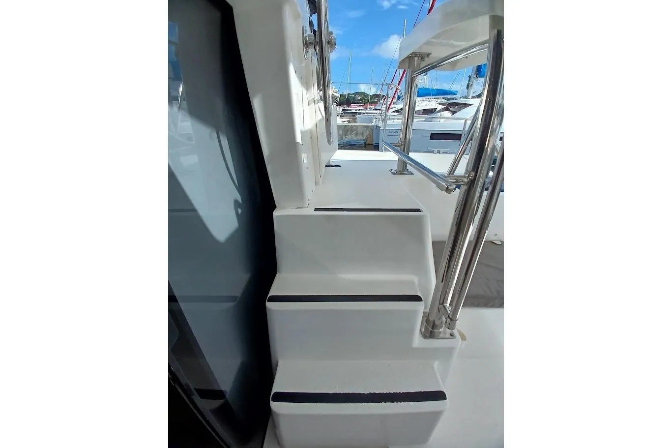 Stairs on a 2020 Leopard 40 yacht, featuring sleek design and stainless steel railings.