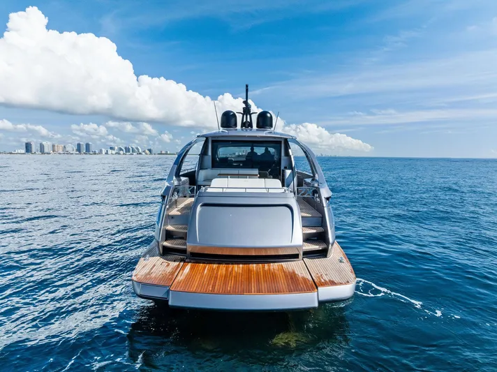 Barnext Yacht Photos Pics Luxury Pershing 7X yacht on open sea, 2025 model, with city skyline in background.