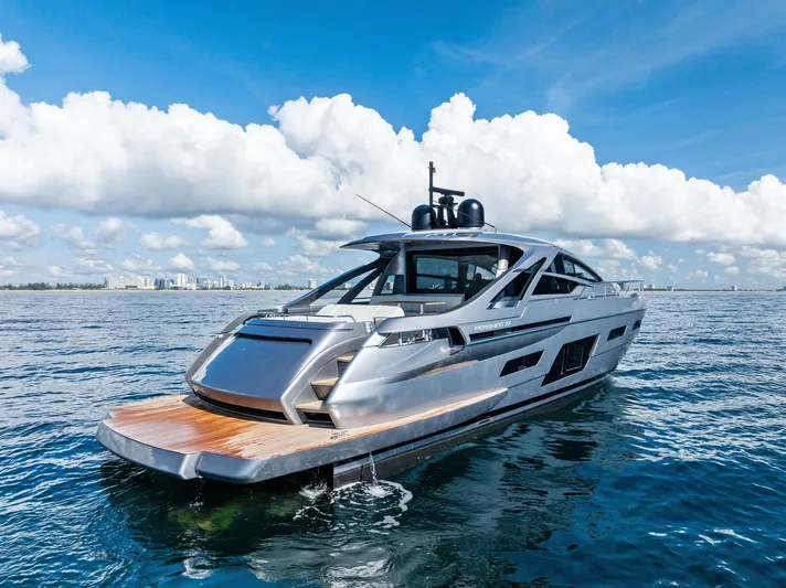 Barnext Yacht Photos Pics Luxury Pershing 7X yacht on open water, 2025 model, under a bright blue sky.