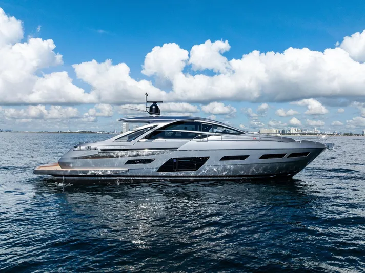 Barnext Yacht Photos Pics 2025 Pershing 7X yacht cruising on open water under a clear blue sky.